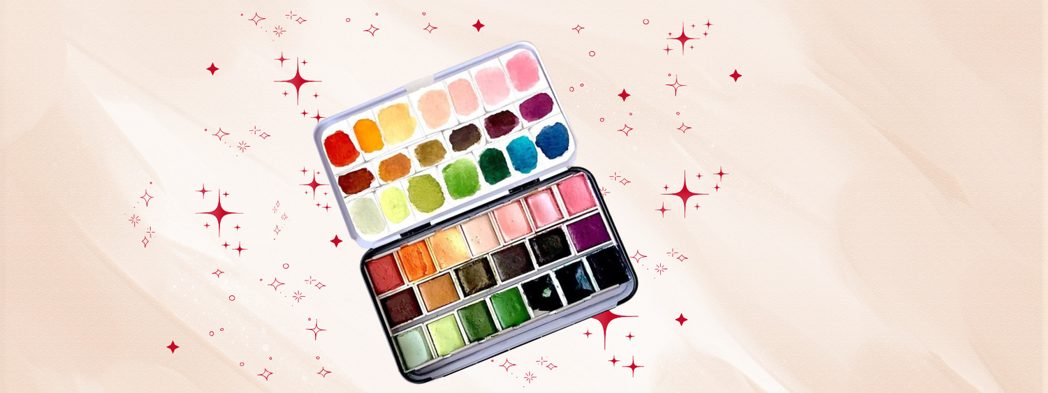 Paleta profesional de acuarelas con 36 tonos vibrantes y pastel, ideal para ilustración y journaling creativo, sobre fondo beige con estrellas rojas decorativas.